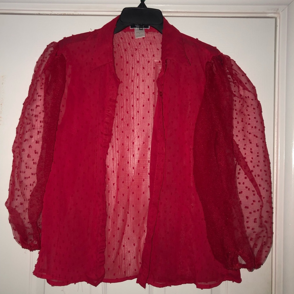 Sheer red blouse.